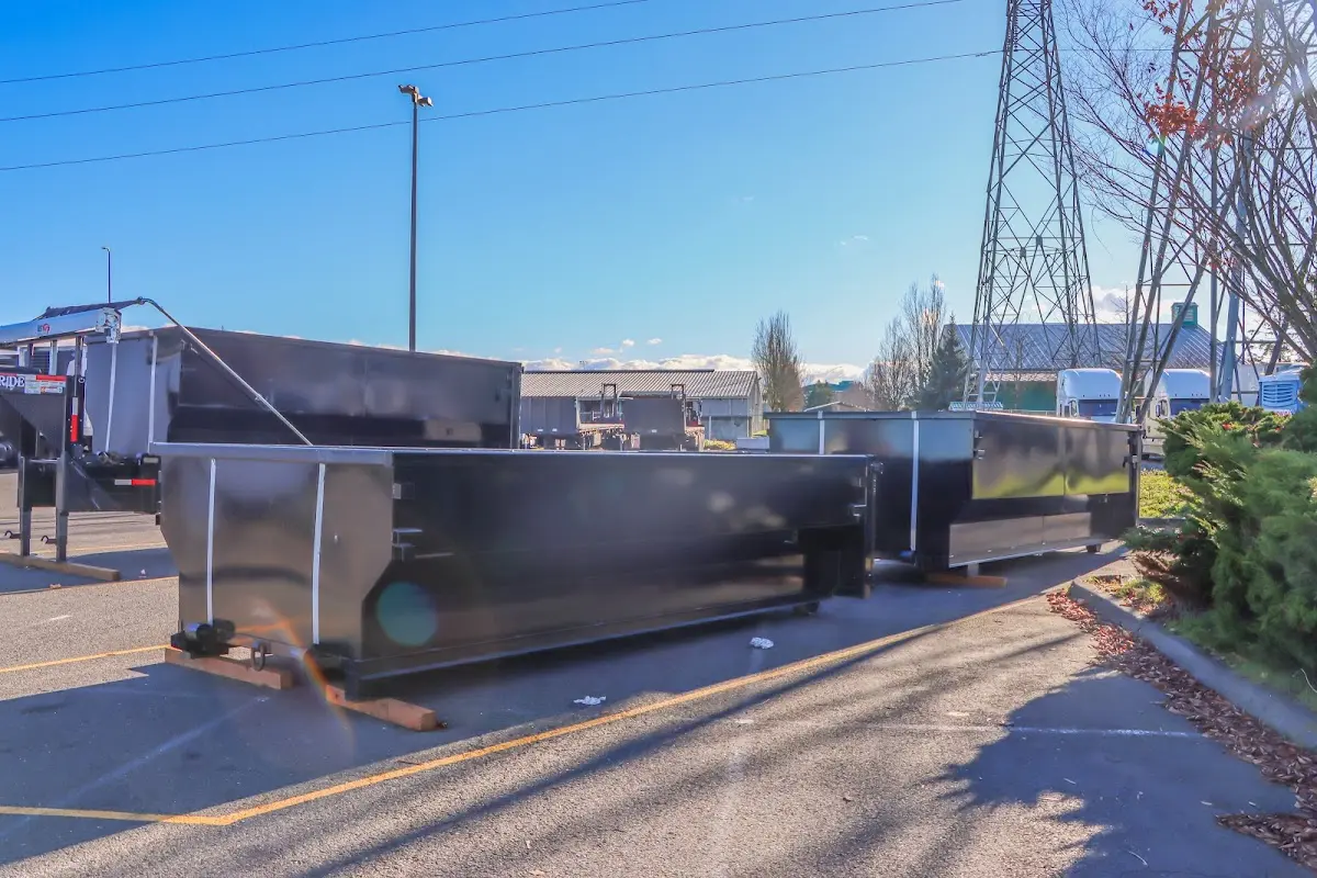 Roll-off dumpster ready for waste disposal at job site for 3 Yard Dumpster Rental in Millis
